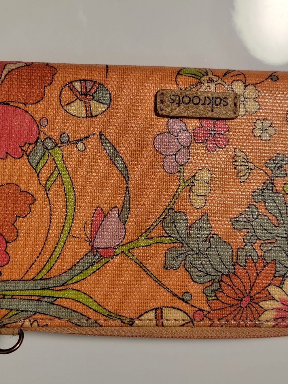 Sakroots Orange Floral Canvas Wristlet with Multicolor Blooms